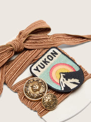 Skins burgundy and peach embroidered laces with patch and two charms