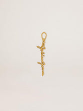 Gold-colored brass charm with Golden Goose signature