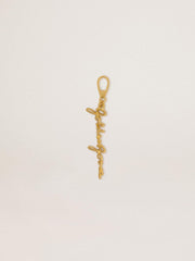 Gold-colored brass charm with Golden Goose signature