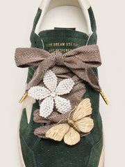 Skin "Sparkling" brown black and silver herringbone laces with two appliqué charms