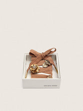 Skins burgundy and peach embroidered laces embellished with charms