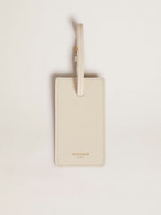 Worn white luggage tag