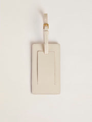 Worn white luggage tag