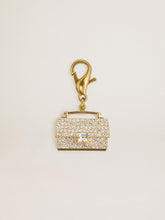 Purse-shaped charm in gold-colored brass with crystals