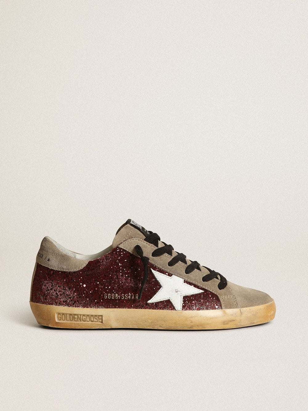 Women's Super-Star in burgundy glitter with white leather star and dove-gray suede tongue