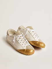 Women's Super-Star LTD in white leather with ice-gray suede inserts and gold-colored tape