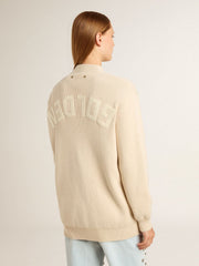 Women’s beige cardigan with 'Golden' lettering on the back