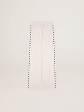 Women’s white joggers with stars on the sides