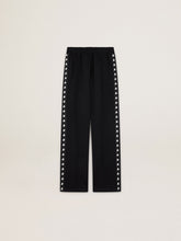 Women’s black joggers with white stars on the sides