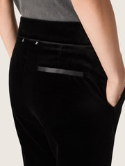 Women's slim-fit flared pants in black cotton velvet