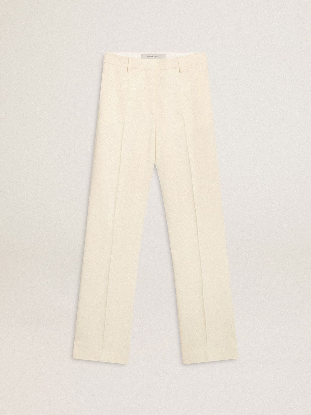 Women's loose pants in worn-white tailored fabric