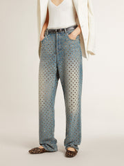 Women's washed jeans with all-over eyelets