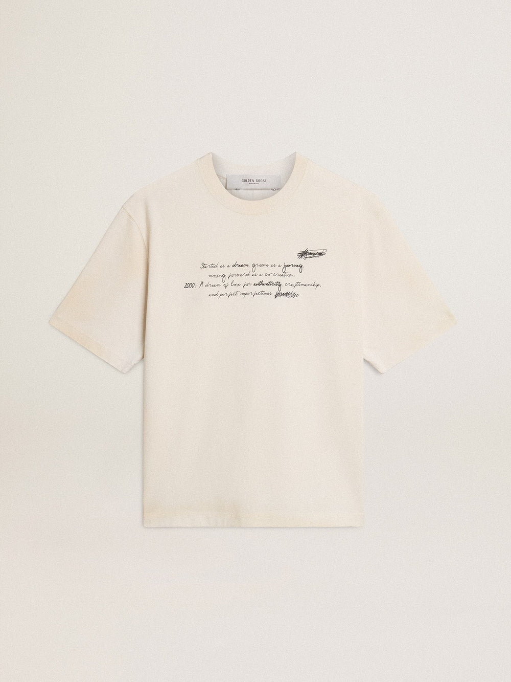 Worn-white unisex T-shirt with printed lettering