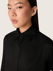 Women's shirt in black wool twill with floral embroidery in glass beads
