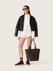 Women's oversized shirt in white cotton with pleated detail and jewel buttons