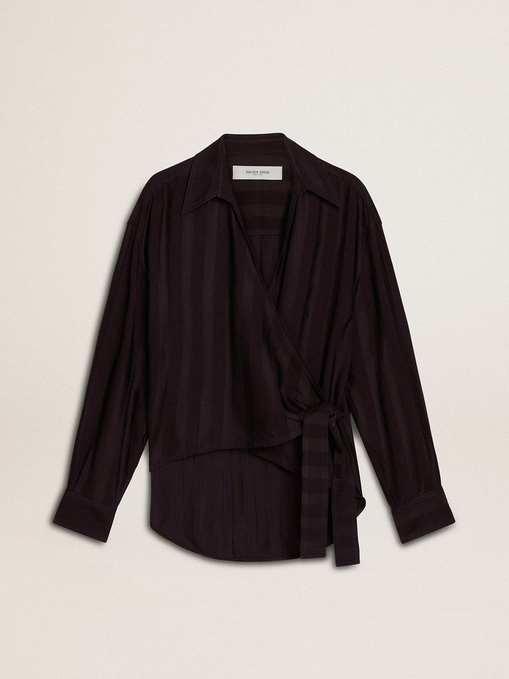 Women's black shirt with vertical stripes and side knot closure