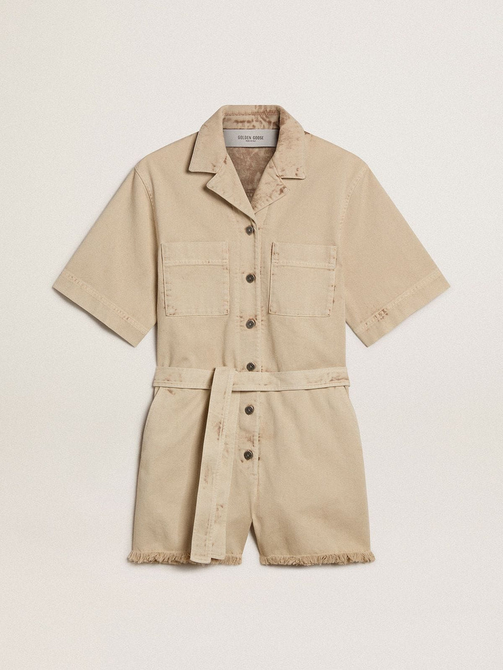 Women's romper in beige denim with belt and frayed hem