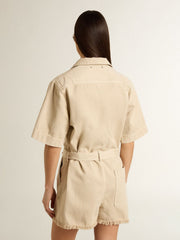 Women's romper in beige denim with belt and frayed hem