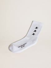 Worn white socks with contrasting black stars