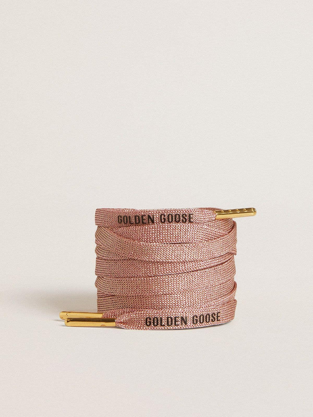 Salmon pink Lurex laces with contrasting black logo