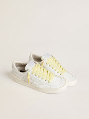 Yellow cotton laces with contrasting gold-colored logo