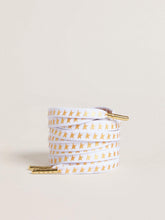 White cotton laces with contrasting gold stars