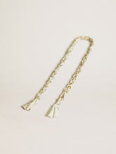 Butter-colored braided fabric charm with brass chain
