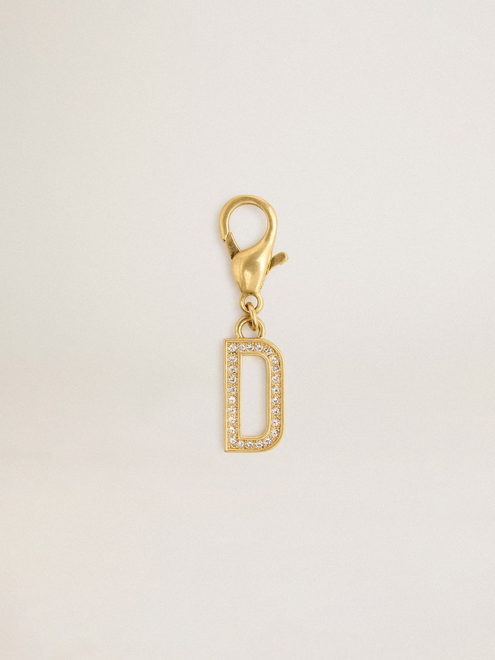 Letter D charm in gold-colored brass with crystals