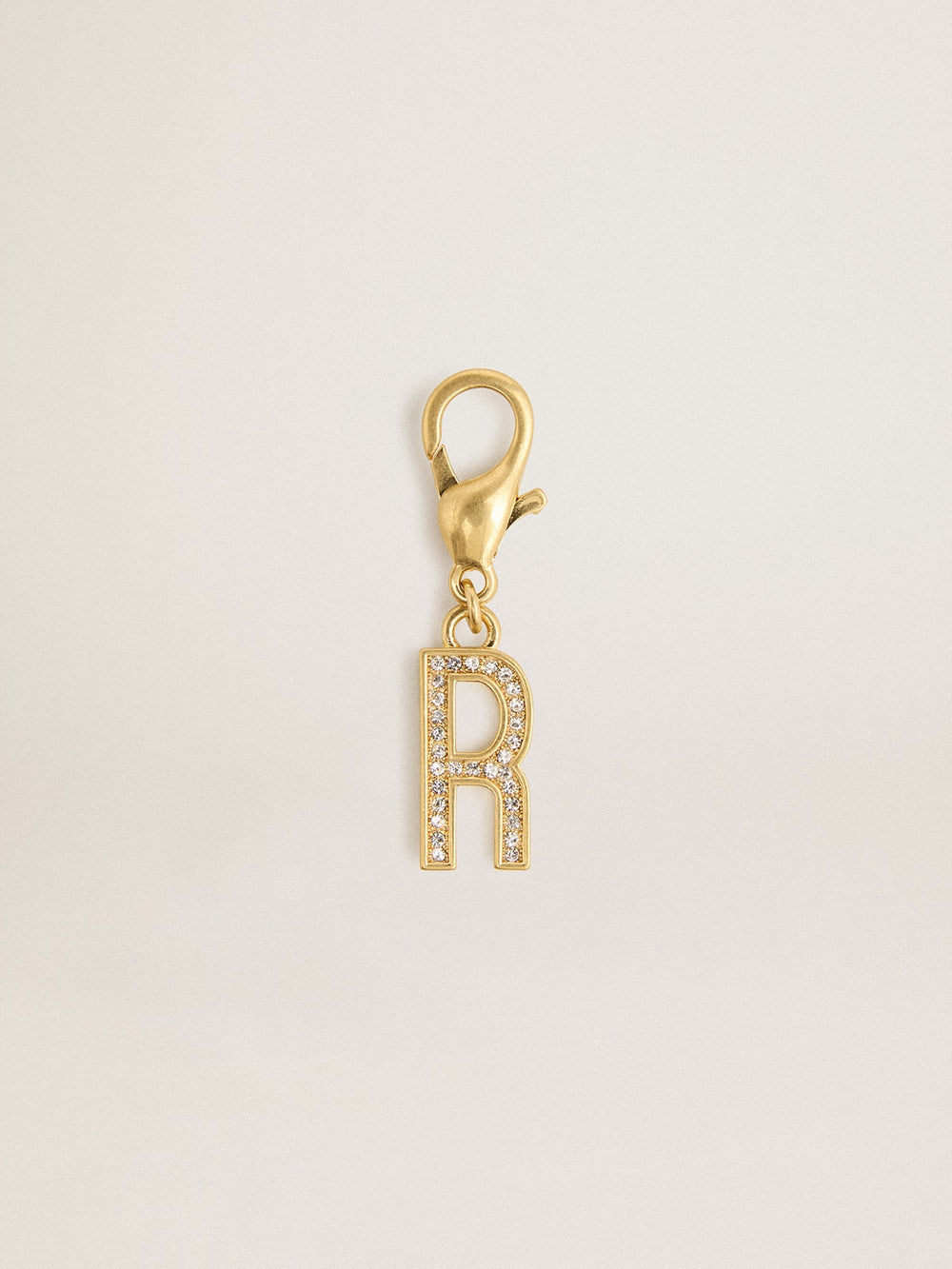 Letter R charm in gold-colored brass with crystals