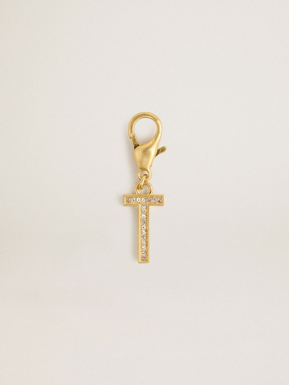 Letter T charm in gold-colored brass with crystals