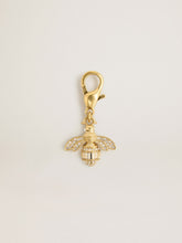 Bee-shaped charm in gold-colored brass with crystals