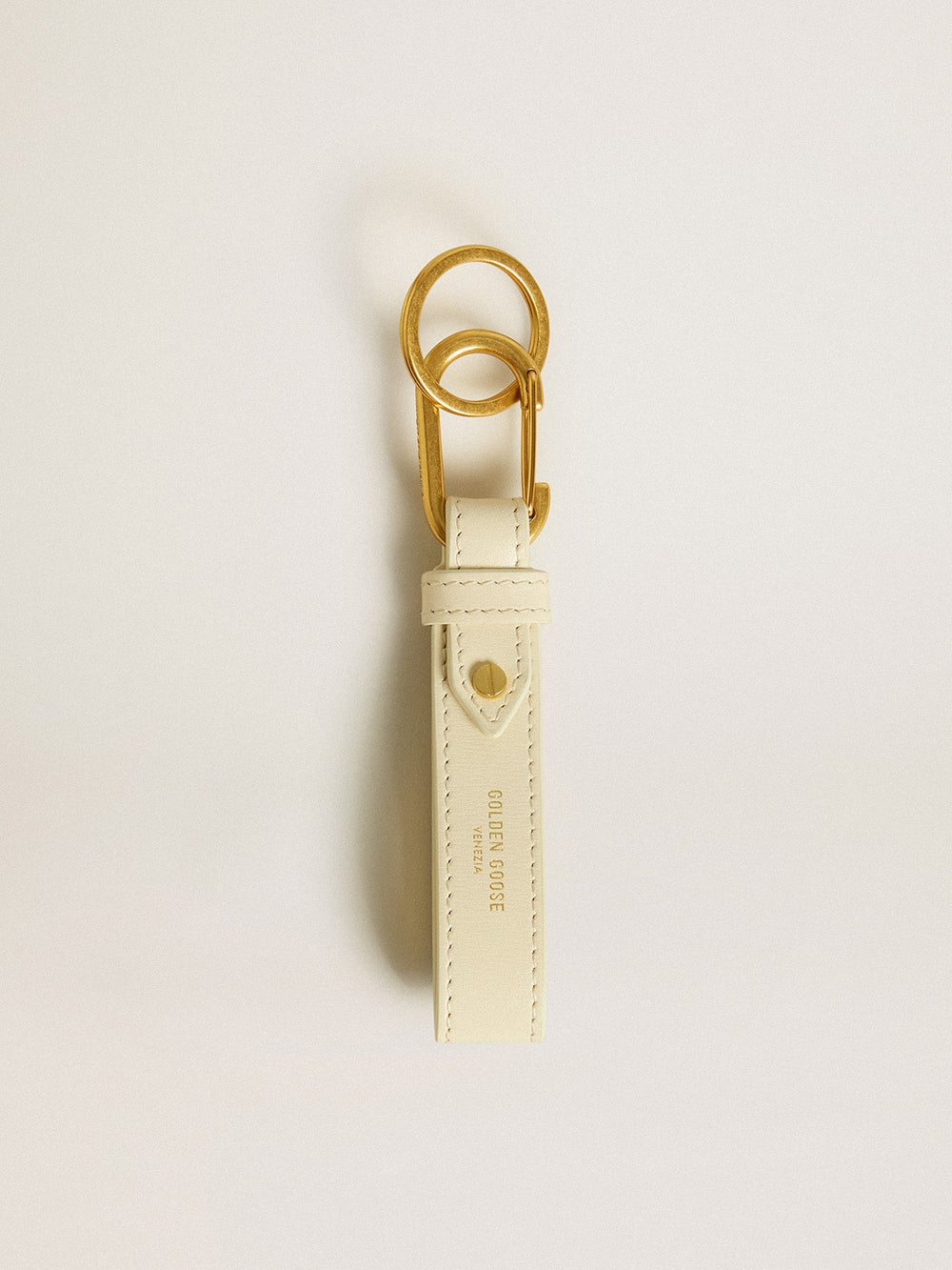 Worn white keyring