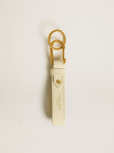 Worn white keyring