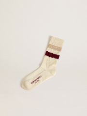Worn-white socks with distressed details and beige and burgundy stripes