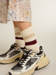 Worn-white socks with distressed details and beige and burgundy stripes