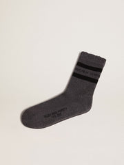 Grey socks with distressed details and black stripes