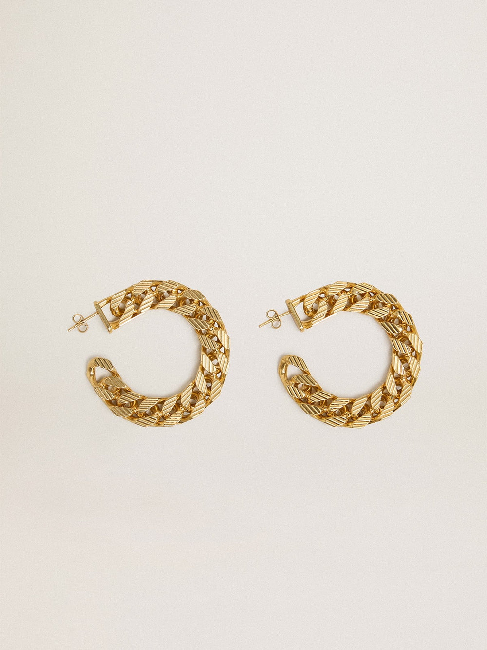Chain hoop earrings with antique gold colored braided links