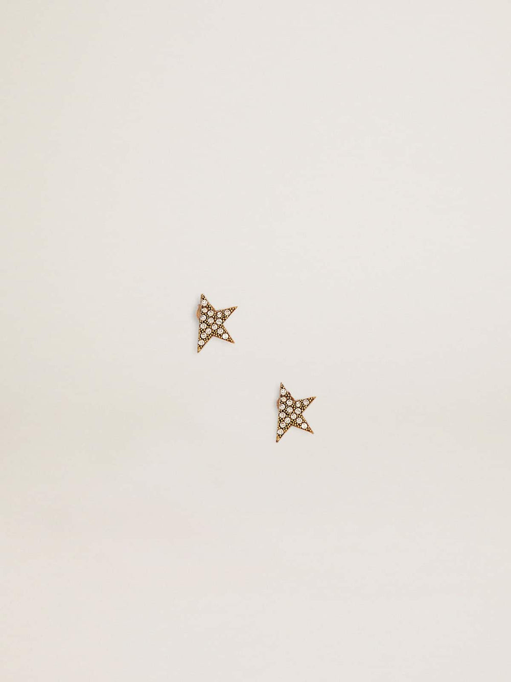 Women's stud earrings in antique gold color with crystals