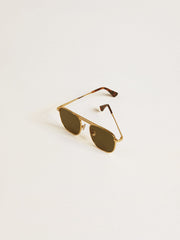 Aviator style sunglasses with gold frame and green lenses