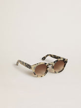 Cameron-style sunglasses with a tortoiseshell pattern
