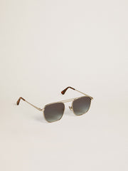 Aviator style sunglasses with silver frame and blue lenses