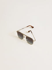 Aviator style sunglasses with silver frame and blue lenses