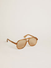 Aviator style sunglasses with honey-colored frame and lenses