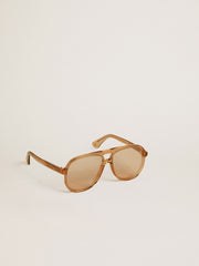 Aviator style sunglasses with honey-colored frame and lenses