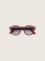 precious stones and blue lenses Cameron Panthos sunglasses with honey frame
