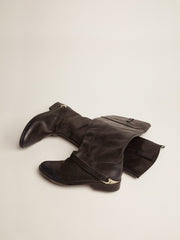 Women's black leather boots with clamp on the heel