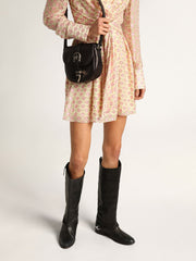 Women's black leather boots with clamp on the heel