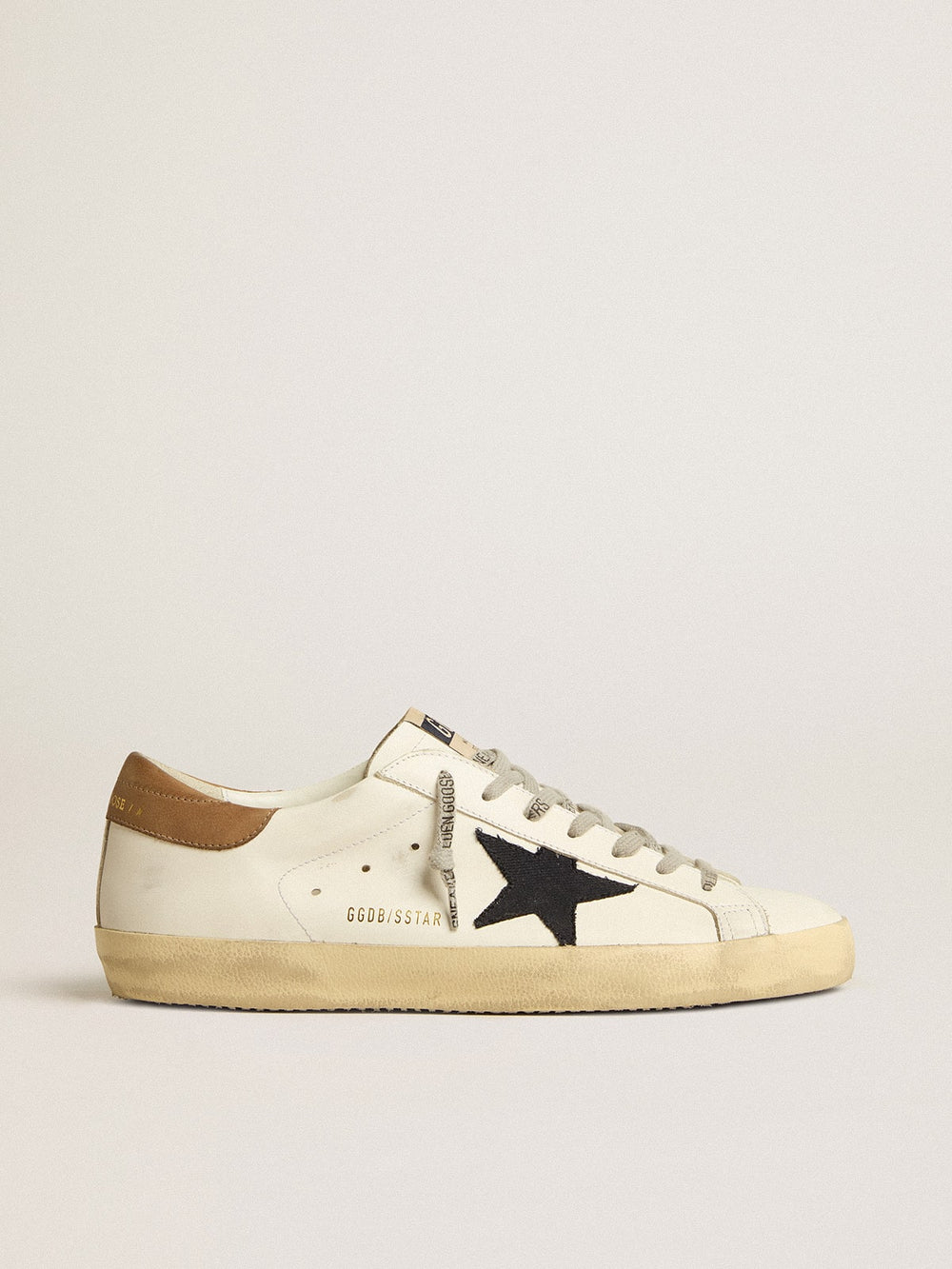 Men's Super-Star in white leather with midnight-blue canvas star and tobacco leather heel tab