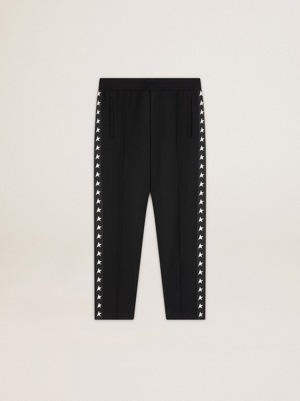 Men's black joggers with white stars on the sides