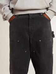 Men's distressed black cotton jeans with front patches